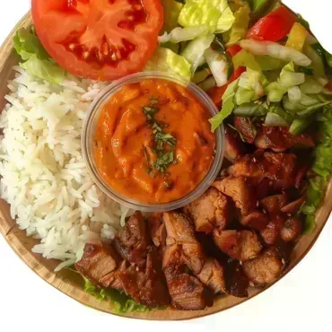 Tandoori Chicken — Fragrant lemon rice with tandoori chicken, fresh veggies, and mint mayo